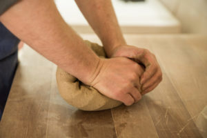Kneading the clay