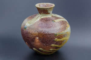 Small vase (side view), fired lying, blue glaze drop on the shoulder