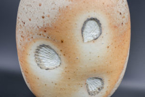 Globe pot (front view), natural porcelain, fired lying on shells