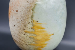 Globe pot (side view), natural porcelain, fired lying on shells